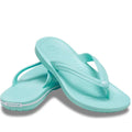 A pair of Crocs - Crocband Flip Aquamarine Adults womens & mens jandals with textured footbeds and white sole detailing, featuring signature Crocs Comfort, arranged slightly overlapping on a white background.