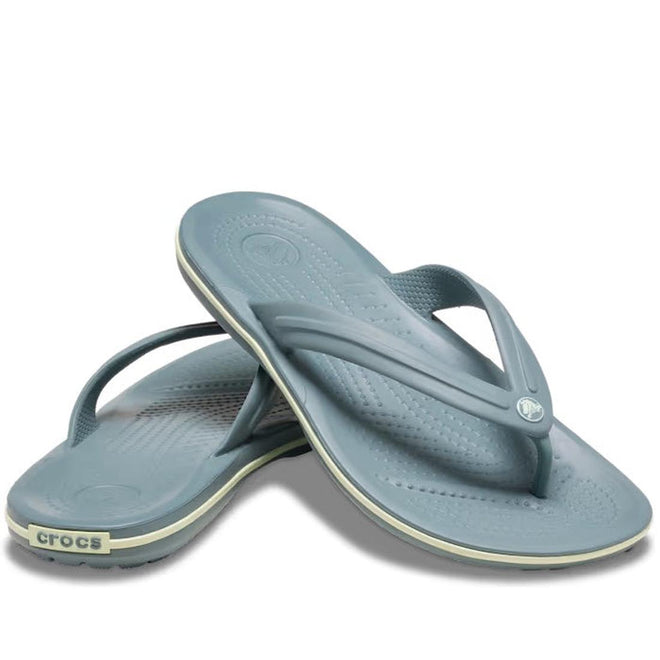 A pair of Crocs - Crocband Flip Pond Blue adults' sandals, one atop the other, display the brand name on the heel and feature textured footbeds for signature Crocs Comfort. Suitable for both women and men.