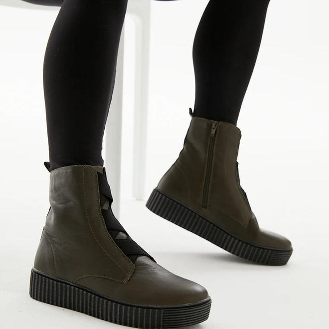 Alfie & Evie Date boot in khaki leather with elastic cross-over front detail, side zip and chunky black Elevate Platform Sole – women’s ankle boot.  On modal showing both insid and outside of leg views