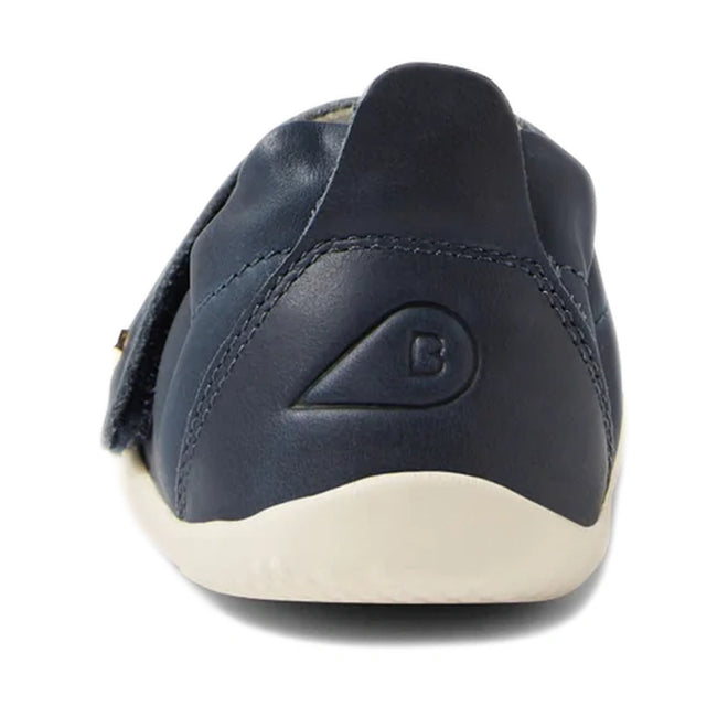 Sure! Here’s a revised version of your sentence using the provided product data: The Bobux XP Explorer Ripple First Walker Navy 502509 is shown from the back, featuring navy blue leather, a white flexible sole, and a raised B logo inside a semicircle on the heel—perfect toddler shoes for little explorers., 42842, 9420068568563, 9420068568570, 9420068568587