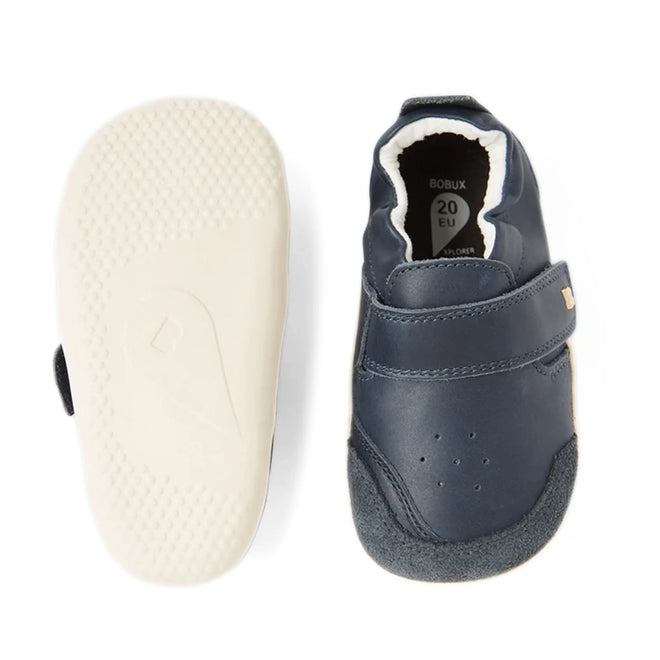 A pair of Bobux XP Explorer Ripple First Walker shoes in navy, one highlighting the velcro strap on top and the other revealing the white, flexible sole. Designed as a first walker shoe for toddlers, size 20 EU is marked inside., 42842, 9420068568563, 9420068568570, 9420068568587