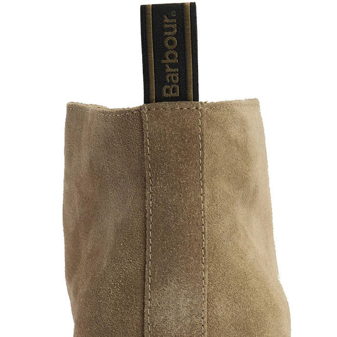 Close-up of the back of a Barbour Mens Blaine Chukka Lace Up Taupe Suede Boot, showing its suede finish and a black and gold pull tab with "Barbour" in gold lettering., 5063669166789, 5063669166796, 5063669166734, 5063669166741