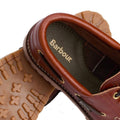 Close-up of Barbour Mens Re-Engineered Deck Boat Shoes Tan, showing brown uppers, tan rubber soles with cross-shaped treads and a sneaker-style design, plus the gold Barbour logo on the insole., 5020985782178, 5020985782659, 5020985783274, 5020985779802, 51888