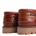 Close-up of the Barbour Mens Re-Engineered Deck Boat Shoes in tan, showing the back and side with thick sneaker-style soles, brass eyelets, and brown leather upper on a white background., 5020985782178, 5020985782659, 5020985783274, 5020985779802, 51888