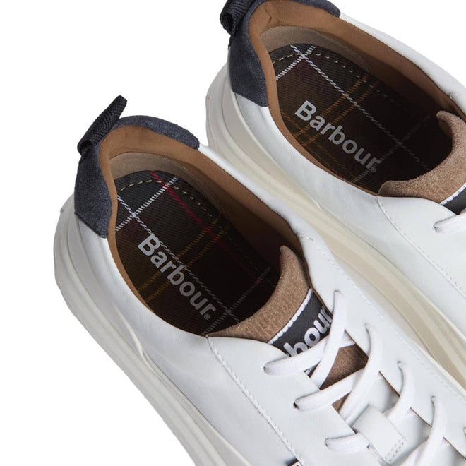 Barbour Mens Stannington White Navy Trench Leather Trainers feature white leather, plaid insoles, beige tongues, and dark blue heel tabs, displayed from above on a white background., 5063669168325, 5063669168332, 5063669168271, 51896