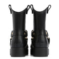 A pair of black Barbour Elley Harness Wellington womens rainboots shown from the back, featuring chunky heels, pull tabs, and gold-tone hardware straps—a modern twist on classic black rubber boots., 5020985983018, 5020985983575, 5020985984107, 5020985984558, 5020985984947, 5020985985340