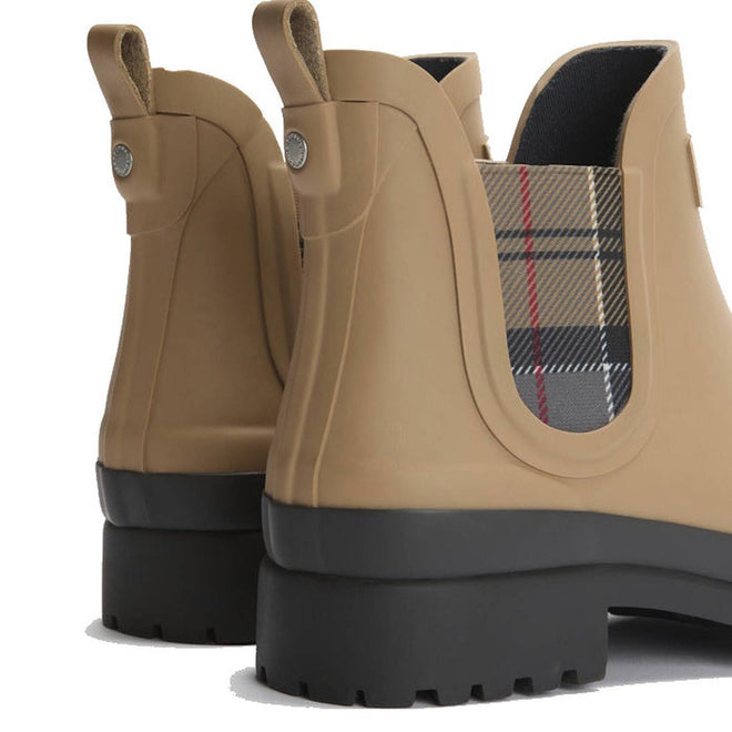 Close-up of the Barbour Mallow Beige Dress Tartan Chelsea Women's Wellington Rainboots, featuring tan weatherproof rubber, thick black soles, and plaid fabric side panels., 5063669170830, 5063669170847, 5063669170854, 5063669170861, 5063669170878, 51814, 52333, 5063669170830, 5063669170847, 5063669170854, 5063669170861, 5063669170878, 51814