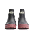 A pair of Barbour Mallow Navy Cherry Blossom Chelsea Womens Wellington Rainboots with thick, matte dark pink soles, shown front-facing on a white background. These waterproof ankle boots display the Barbour logo on the front., 5063669170908, 5063669170915, 5063669170922, 5063669170939, 5063669170946, 5063669170953