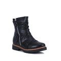 The Bay Lane Calista Black Leather Zip Boot is an orthotic-friendly ankle boot featuring a round toe, side zipper, chunky treaded sole, and brown edge trim.