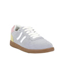 The Bay Lane Sunny Grey Suede Retro Lace Up Multi Fit Trainer features light gray suede, white laces and side stripes, a light brown rubber sole, and pastel pink and yellow heel accents, shown on a plain white background.