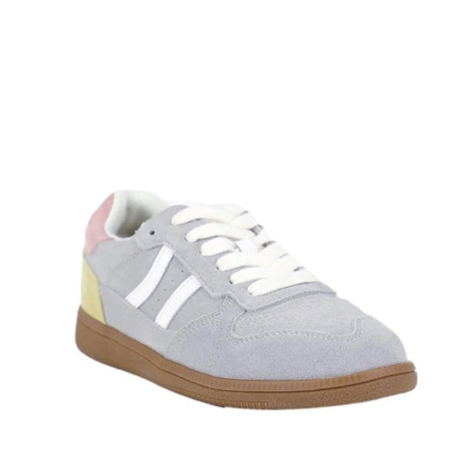 The Bay Lane Sunny Grey Suede Retro Lace Up Multi Fit Trainer features light gray suede, white laces and side stripes, a light brown rubber sole, and pastel pink and yellow heel accents, shown on a plain white background.