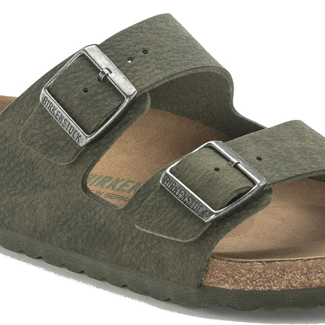 Showing the detail of the birkenstock vegan slide Green sandal with silver buckles on a white background., 4061418353306,
4061418353344,
4061418353382,
4061418353429,