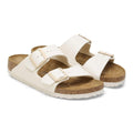 Pair of whiteBirkestock slides arizona sandals with cork soles on a white background.
4066648369509,
4066648369547,
4066648369585,