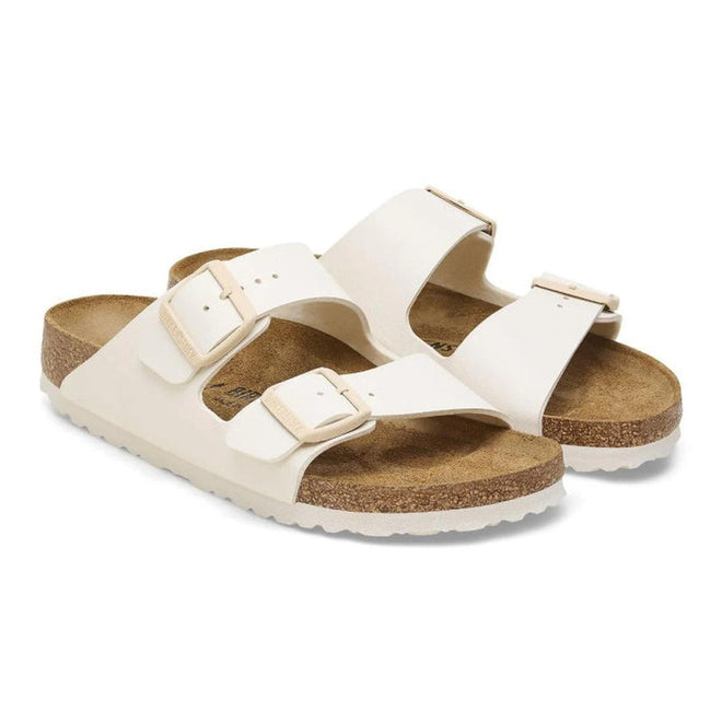 Pair of whiteBirkestock slides arizona sandals with cork soles on a white background.
4066648369509,
4066648369547,
4066648369585,