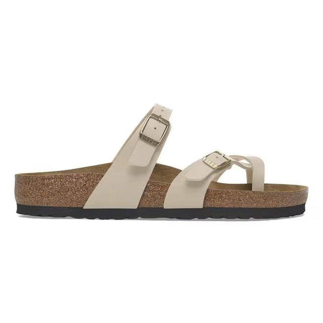 A side view of a mayari sandcastle beige sandal.,
4067707169030,
4067707169078,
4067707169115,
4067707169153,