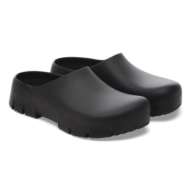 A pair of BIRKENSTOCK Super Birki 2.0 Polyurethane clogs in black, regular width, with slip-resistant textured soles and smooth uppers, shown side by side on a white background., 50301, 4061418845184, 4061418845221, 4061418865267, 4061418868336, 4061418845344, 4061418845382, 4061418845429, 4061418845467, 50310