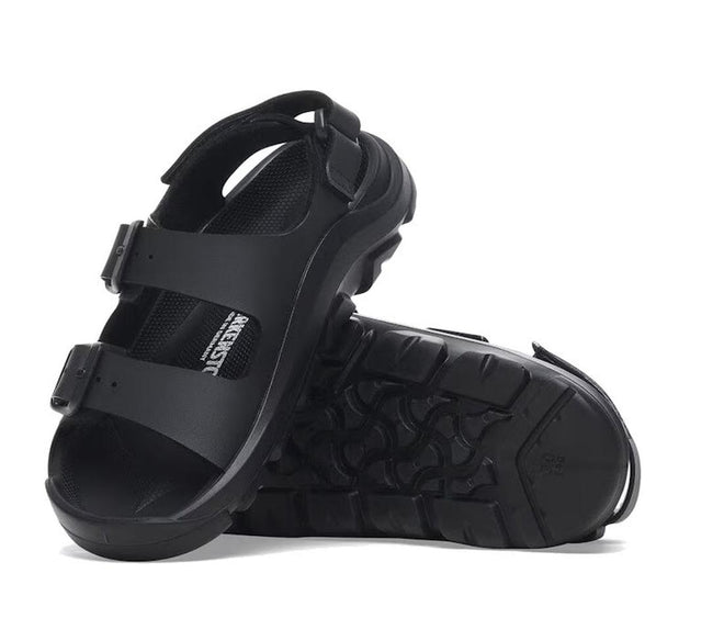 The Birkenstock Mogami Terra Kids Black Birko Flor Sandal features adjustable straps and rugged, textured soles—perfect water-friendly sandals for active kids. One stands upright, the other lies on its side to showcase durability.