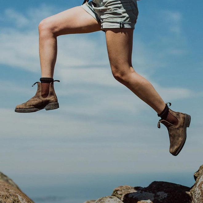 a women jumping from rocks wearing a pair of blundstone chelsea 1306 boots.  The boots showing wear but still with a lot of life left.
9315891441018,
9315891441032,
9315891441056,
9315891441070,
9315891441094,
9315891441117,
9315891441131,
9315891441155,
9315891441179,
9315891441186,