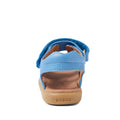 The Bobux IW Iwalk Strand Sandal in Azure Blue features a tan sole, open heel and toe, "BOBUX" on the back, and adjustable ankle straps for a secure fit—shown here from the rear view., 9420068556997, 9420068557000, 9420068557017, 9420068557024, 9420068557031