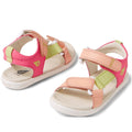 The Bobux IW Iwalk Vine Sandal Pink Lemonade Open Toe is a kids' sandal in pink, peach, and green with adjustable straps, white stitching, and soft cushioned soles. Made of leather with an open toe, it's shown on a white background.