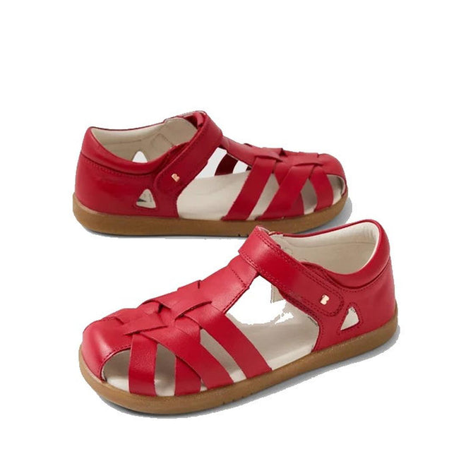 The Bobux Kids Plus KP Tropicana II Salsa Red Closed Toe Leather Sandal features red leather, cutout sides, tan rubber soles, and is water-resistant. These kids sandals are pictured on a white background.