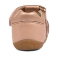A dusk pearl pink leather Bobux Step Ups Cross Jump closed toe sandal seen from the back, featuring “BOBUX” embossed on the heel and a tan rubber sole—perfect as a stylish first walker for little ones taking their first steps., 9420062083222, 9420062083239, 9420062083246, 9420062083253
