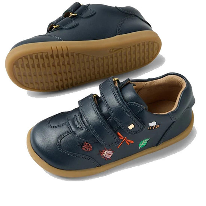The Bobux Iwalk Buggie Navy Embroidered Toddlers Trainer features navy Quickdry leather, tan rubber soles, Velcro straps, and playful embroidered designs: ladybug, dragonfly, leaf, and snail for comfort and durability., 9420074829283, 9420074829290, 9420074829306, 9420074829313, 9420074829320
