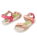 The Bobux Kid+ Plus Vine Leather Pink Lemonade Open Toe Sandal Junior features pink, peach, and light green straps, white soles, and adjustable Velcro closures—ideal water-friendly sandals for summer adventures.