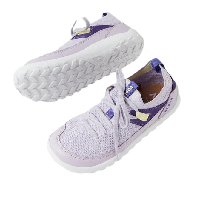 The Bobux Kid+ Meta Knit Barefoot Sneaker in Thistle Lavender for juniors features breathable mesh uppers, purple accents, white soles, and flexible non-slip outsoles. Displayed on a white background with one shoe upright and one sole shown., 9420074835949, 9420074835956, 9420074835963, 9420074835970, 9420074835987, 46350, 46351