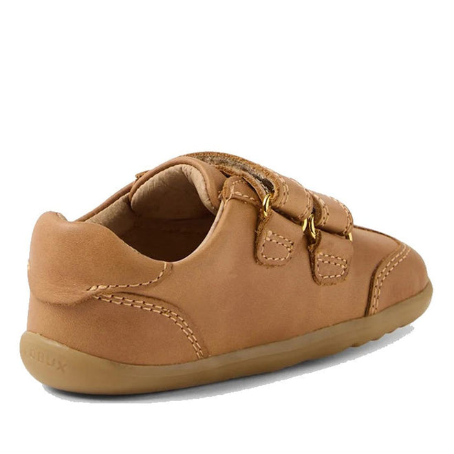 The Bobux Step Up Buggie Embroidered First Walker Sneaker in Caramel is a tan toddler shoe made from Quickdry leather, featuring a soft sole, two velcro straps, visible stitching, and a rounded heel shown from the side and back., 9420074828552, 9420074828569, 9420074828576
