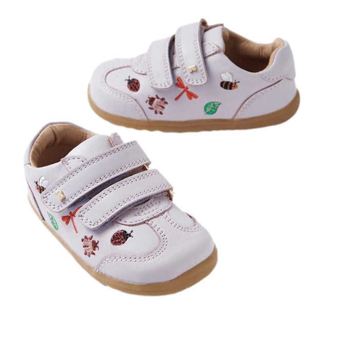 The Bobux Step Up Buggie Embroidered Sneaker in Thistle Purple features quick-dry leather, double Velcro straps, and embroidered insects and leaves—perfect first walker shoes for adventurous toddlers.