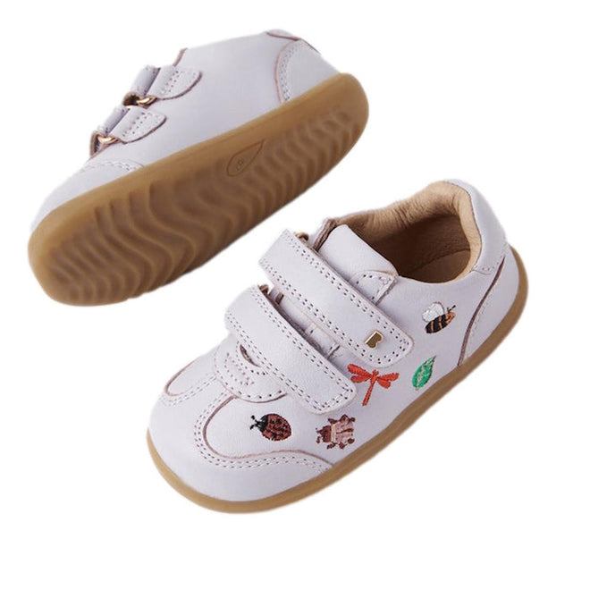 The Bobux Step Up Buggie Embroidered Sneaker Thistle Purple features double velcro, tan rubber soles, and colorful embroidered insects, a leaf, and a bow—ideal first walkers for toddlers starting to explore., 9420074828507, 9420074828514, 9420074828521