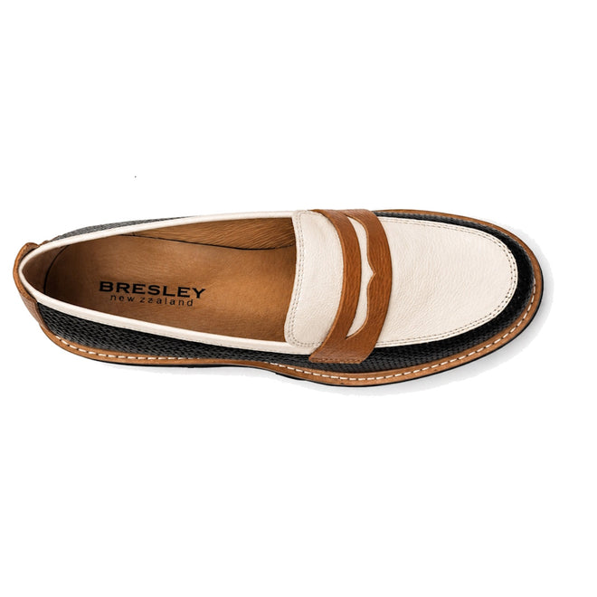 Top view of the Bresley Delmira Black Combo Leather Loafer with a white upper, brown strap, tan lining, black textured sides, visible stitching, and BRESLEY New Zealand branded insole—a standout black combo loafer., 51680, 51681, 51682, 51683, 51684