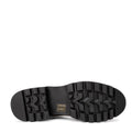 The image shows the bottom view of a Bresley Delmira Black Combo Leather Loafer, highlighting its chunky sole with deep, rugged treads for grip and a small gold-colored label with symbols near the arch area., 51680, 51681, 51682, 51683, 51684