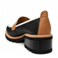 The Bresley Delmira Black Combo Leather Loafer features a black woven upper, chunky black heel, tan leather accents on the back and trim, and a thick sole, shown from a back side angle against a white background., 51680, 51681, 51682, 51683, 51684
