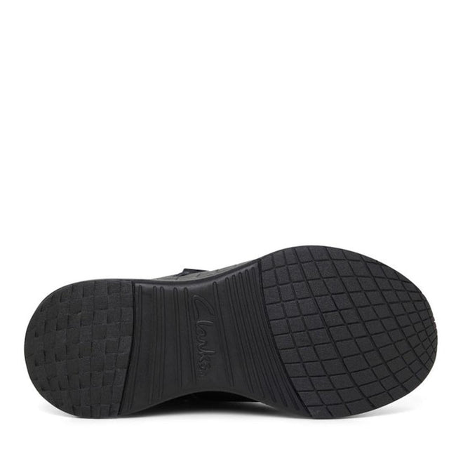 The image shows the black rubber sole of the Clarks Hurry Black Leather School Shoe with a textured tread and embossed branding, highlighting its durability—ideal for school with features like a self-fastening strap., 34987, 34988, 34989, 34990, 9336078625489, 9336078625502, 9336078625526, 9336078625540, 9336078625564, 9336078625588