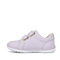 The Clarks Toddlers Macy Lilac Leather Trainer is a light purple leather sneaker for girls with two hook-and-loop straps, white stitching, and a white rubber sole, shown side view on a plain white background. Ideal for comfortable kids’ footwear., 9336078203618, 9336078203656, 9336078203694, 9336078203731, 9336078203779