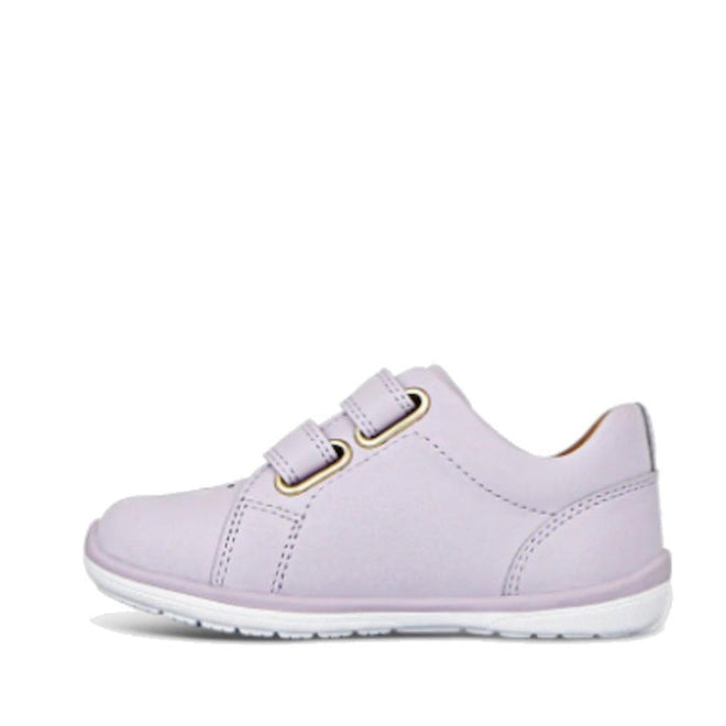 The Clarks Toddlers Macy Lilac Leather Trainer is a light purple leather sneaker for girls with two hook-and-loop straps, white stitching, and a white rubber sole, shown side view on a plain white background. Ideal for comfortable kids’ footwear., 9336078203618, 9336078203656, 9336078203694, 9336078203731, 9336078203779