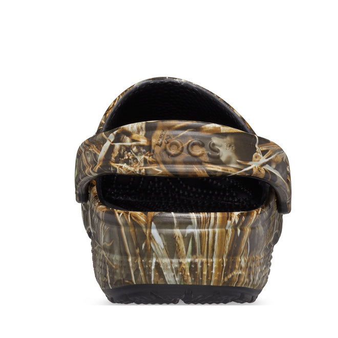 A rear view of the Crocs Classic Clog Realtree MAX7 Adults Unisex shows its camouflage design, black Croslite foam insole, raised heel strap, and visible tread on the sole., 51772, 196265815142, 196265815159, 196265815166, 196265815173, 196265815180, 196265815036, 196265815043, 196265815050, 196265815067, 51782