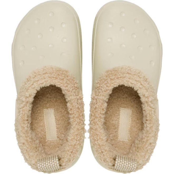 A pair of Crocs Adults Classic Lined Shorty Clog in Sandstone Off White, featuring textured soles and warm tan faux fur lining around the opening, viewed from above., 198445245961, 198445245978, 198445245985, 198445245992, 198445246005, 198445246012, 198445245923, 198445245930