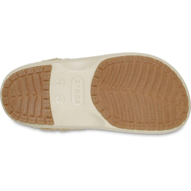 The image shows the bottom view of a Crocs Adults Classic Lined Shorty Clog in Sandstone Off White, featuring a beige design with a textured tan rubber sole and "Crocs" stamped at the center., 198445245961, 198445245978, 198445245985, 198445245992, 198445246005, 198445246012, 198445245923, 198445245930
