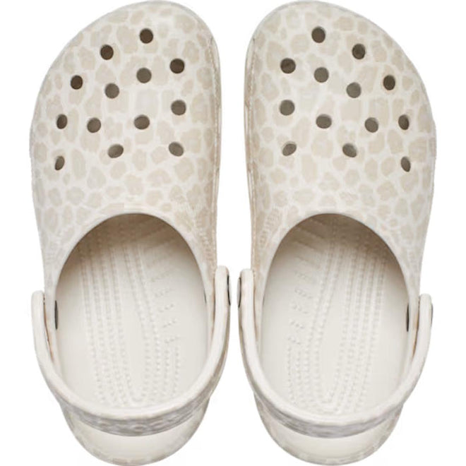 The Crocs Adults Classic Animal Clog in Almond Tint Leopard is a light beige clog with a leopard print, featuring top ventilation holes and adjustable heel straps for comfort. Viewed from above, its lightweight design stands out., 51497, 198445344978, 198445344961, 198445344985, 51501, 51502, 51503