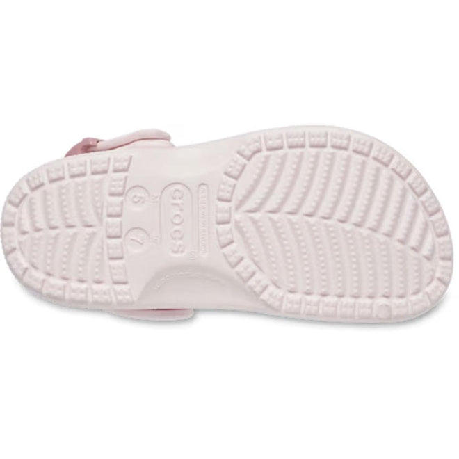 The sole of a Crocs Adults Classic Enamel Buckle Clog Bubble Ice Pink is shown from the bottom, with a textured non-slip tread made of Croslite foam and the Crocs logo plus sizing info embossed in the center., 198445416422, 198445416439, 198445416446, 198445416453, 198445416460, 51509