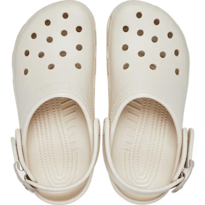 The Crocs Adults Classic Enamel Buckle Clog Frappe features ventilation holes, a pivoting heel strap, and cushioned Croslite foam for Crocs Comfort., 198445415944, 198445415951, 198445415968, 198445415975, 198445415982, 198445415999