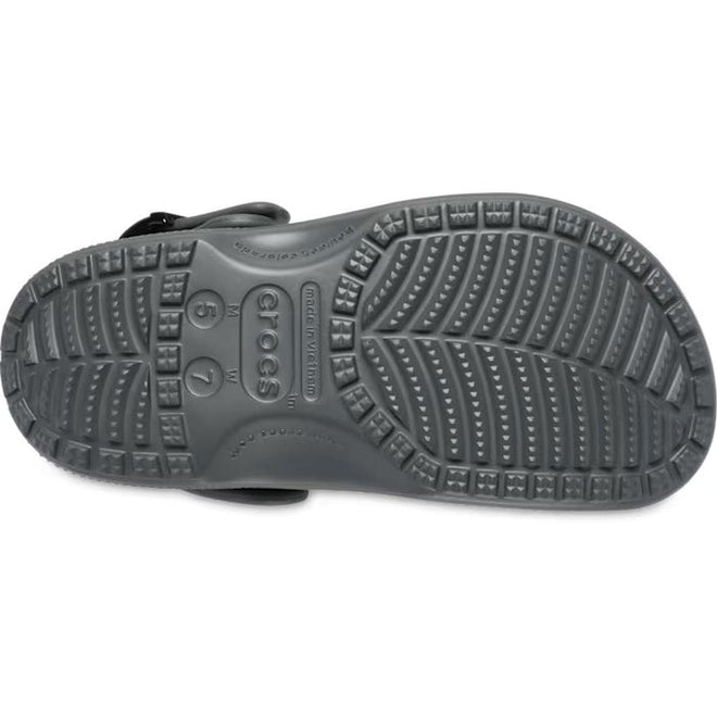 The underside of the Crocs Adults Classic Enamel Buckle Clog Carbon Grey reveals detailed tread, size markings 6 7, and the Crocs logo molded into its Croslite foam sole., 51696, 198445415715, 198445415722, 198445415739, 51700, 51701, 51696, 198445415715, 198445415722, 198445415739, 198445415746, 51701