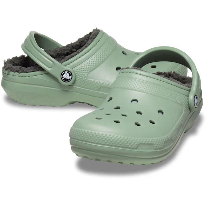 A pair of Moss green Adults Crocs classic lined clogs with a furry lining visible from the side.,
