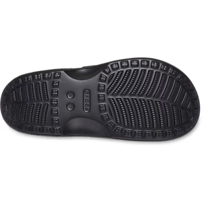The bottom view of the Crocs Womens Classic Metallic Buckle Saturday Sandal Slide Black reveals its textured non-slip sole with grooves and the Crocs logo at the center, ensuring signature Crocs Comfort for all-day wear., 50021, 198445392788, 198445392795, 198445392801, 198445392818, 198445392740, 198445392757