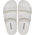 A pair of Crocs Womens Classic Saturday Sandal Slide White, featuring Crocs Comfort, two adjustable straps with buckles, and “crocs” printed in black on the footbeds, shown from above., 50014, 50015, 198445397431, 198445397448, 198445397455, 50019, 50020