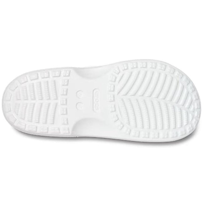 The image shows the sole of the Crocs Womens Classic Saturday Sandal Slide White, featuring a textured tread with rectangular and curved grooves for grip. The Crocs brand name is centered, emphasizing signature Crocs Comfort., 50014, 50015, 198445397431, 198445397448, 198445397455, 50019, 50020