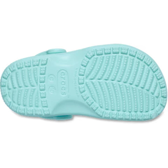 The image shows the sole of the Crocs Toddlers Aquamarine Classic Clog, featuring a textured tread with raised lines, dots, and the Crocs logo embossed in the center of this water-friendly sandal., 51491, 51492, 198445197758, 198445197765, 198445197772, 198445197710